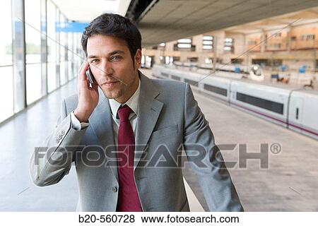 Businessman. AVE, Tren Alta Velocidad. Delicias station, Zaragoza, Arag? n. Spain. View Large Photo Image Stock Photo - Businessman. AVE, Tren Alta Velocidad. Delicias station, Zaragoza, Arag? n. Spain.. Fotosearch