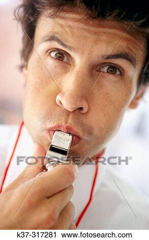 Businessman blowing a whistle View Large Photo Image Stock Image - Businessman blowing a whistle. Fotosearch