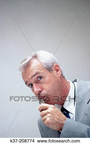 Businessman blowing whistle View Large Photo Image Picture - Businessman blowing whistle. Fotosearch
