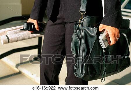 Businessman carrying briefcase View Large Photo Image Stock Image - Businessman carrying briefcase. Fotosearch