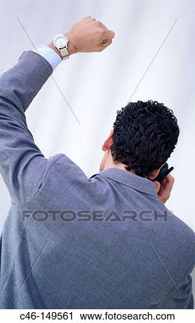 Businessman clenching fist View Large Photo Image Stock Image - Businessman clenching fist. Fotosearch