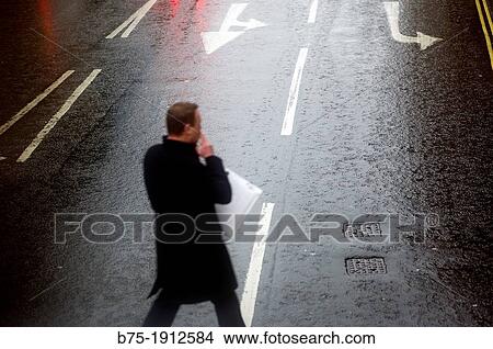 businessman crossing a city street, Fleet Street, London, England, UK View Large Photo Image Picture - businessman crossing a city street, Fleet Street, London, England, UK. Fotosearch