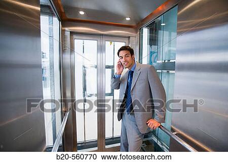 Businessman. Elevator. Train station. Lleida, Catalua. Spain. View Large Photo Image Stock Image - Businessman. Elevator. Train station. Lleida, Catalua. Spain.. Fotosearch