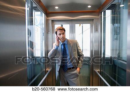 Businessman. Elevator. Train station. Lleida, Catalua. Spain. View Large Photo Image Stock Photo - Businessman. Elevator. Train station. Lleida, Catalua. Spain.. Fotosearch