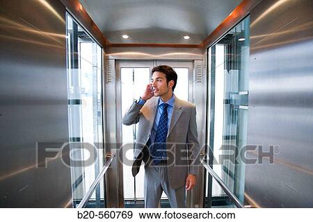 Stock Photo - Businessman. Elevator. Train station. Lleida, Catalua. Spain.. Fotosearch