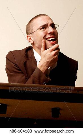 Businessman grinning View Large Photo Image Stock Image - Businessman grinning. Fotosearch