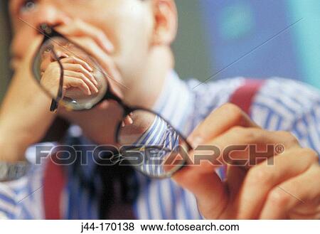 Businessman holding glasses View Large Photo Image Stock Photo - Businessman holding glasses. Fotosearch