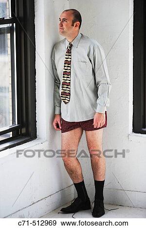 Businessman in corner looking out of the window. View Large Photo Image Stock Photo - Businessman in corner looking out of the window.. Fotosearch