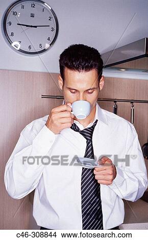 Businessman in the kitchen View Large Photo Image Picture - Businessman in the kitchen. Fotosearch