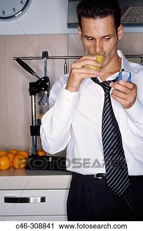Businessman in the kitchen View Large Photo Image Stock Image - Businessman in the kitchen. Fotosearch