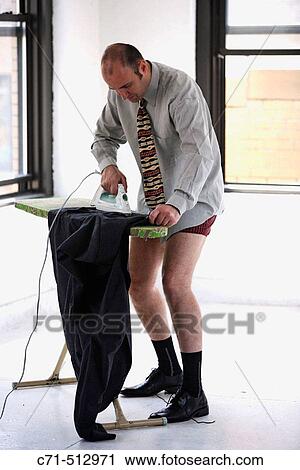 Businessman in underwear ironing his clothes. View Large Photo Image Stock Image - Businessman in underwear ironing his clothes.. Fotosearch