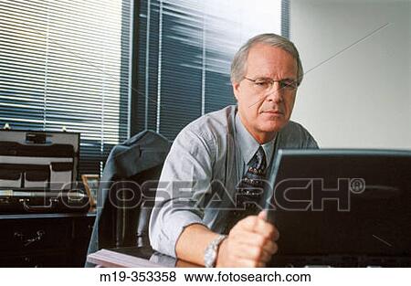 businessman looking at lap top View Large Photo Image Stock Photo - businessman looking at lap top. Fotosearch