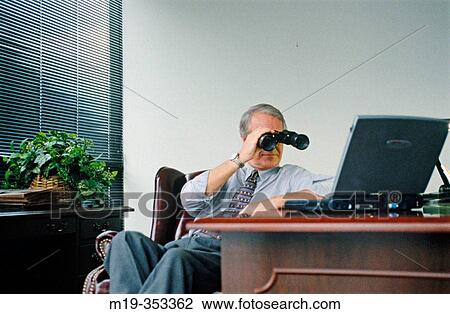 businessman looking at lap top with binoculars View Large Photo Image Stock Image - businessman looking at lap top with binoculars. Fotosearch