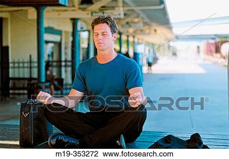 businessman meditating in a train station View Large Photo Image Stock Image - businessman meditating in a train station. Fotosearch