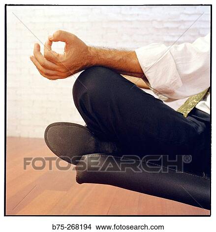 Businessman meditating View Large Photo Image Picture - Businessman meditating. Fotosearch