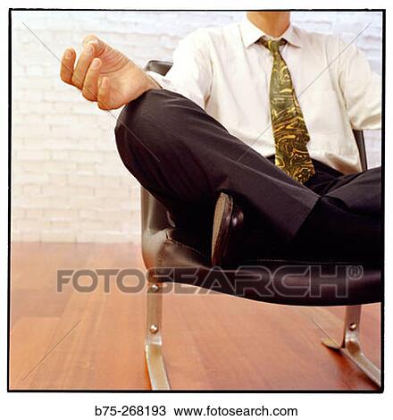 Stock Image - Businessman meditating. Fotosearch