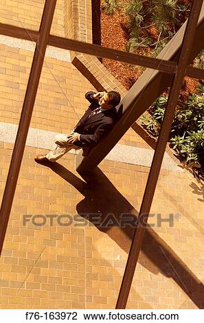 Stock Image - Businessman on cell phone. Fotosearch