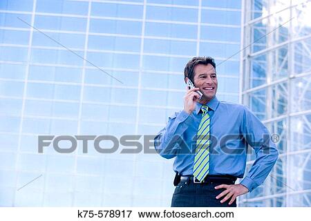 Businessman on cell phone View Large Photo Image Stock Photo - Businessman on cell phone. Fotosearch