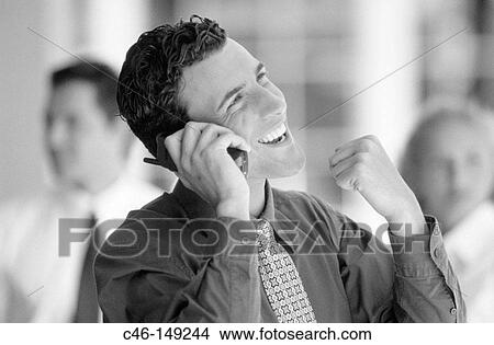 Picture - Businessman on cellular phone. Fotosearch