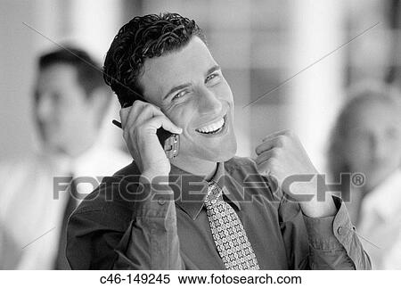 Stock Photography - Businessman on cellular phone. Fotosearch