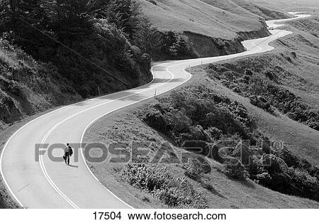 Businessman on lonely road View Large Photo Image Picture - Businessman on lonely road. Fotosearch