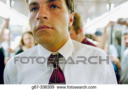 Businessman on subway train. New York city. USA. View Large Photo Image Stock Photo - Businessman on subway train. New York city. USA.. Fotosearch
