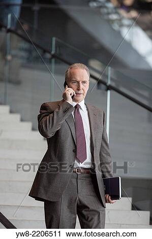 Stock Image - Businessman on the phone, Reykjavik, Iceland.. Fotosearch