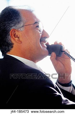Businessman on the phone View Large Photo Image Stock Image - Businessman on the phone. Fotosearch