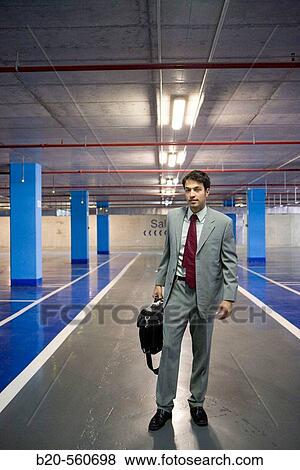 Businessman. Parking lot. View Large Photo Image Stock Photo - Businessman. Parking lot.. Fotosearch
