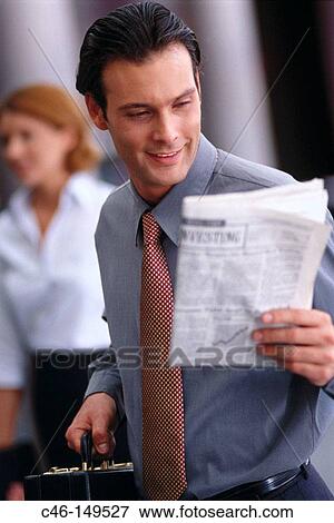Stock Photo - Businessman reading financial newspaper. Fotosearch