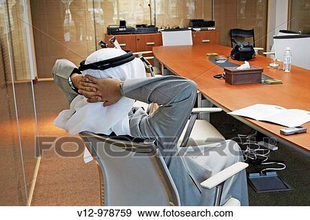 Businessman relax in office View Large Photo Image Stock Photo - Businessman relax in office. Fotosearch