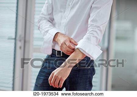 Businessman rolling up sleeves, Business, Donostia, San Sebastian, Basque Country, Spain. View Large Photo Image Picture - Businessman rolling up sleeves, Business, Donostia, San Sebastian, Basque Country, Spain.. Fotosearch