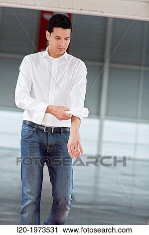 Businessman rolling up sleeves, Business, Donostia, San Sebastian, Basque Country, Spain. View Large Photo Image Stock Image - Businessman rolling up sleeves, Business, Donostia, San Sebastian, Basque Country, Spain.. Fotosearch