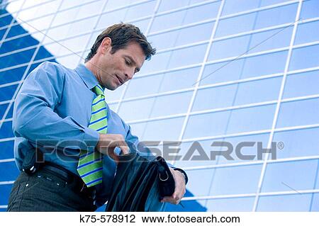 Businessman searching his briefcas View Large Photo Image Stock Image - Businessman searching his briefcas. Fotosearch