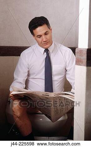Businessman sitting on the toilet reading the paper View Large Photo Image Stock Photo - Businessman sitting on the toilet reading the paper. Fotosearch