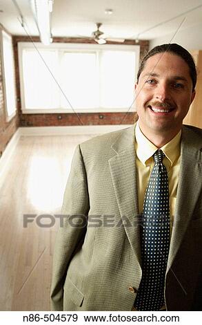 Stock Photo - Businessman smiling. Fotosearch