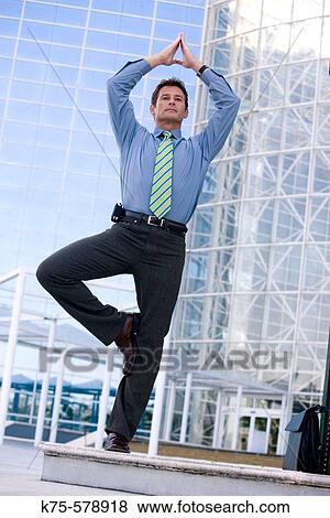businessman taking time for meditation View Large Photo Image Stock Photo - businessman taking time for meditation. Fotosearch