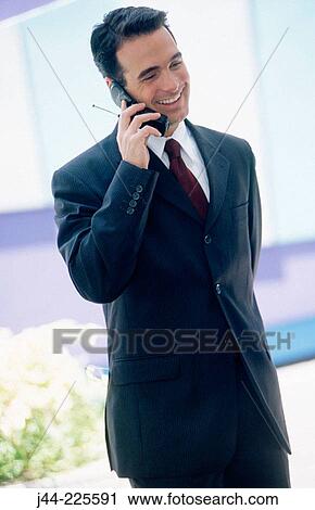 Businessman talking on cell phone View Large Photo Image Stock Image - Businessman talking on cell phone. Fotosearch