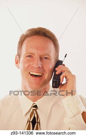 Stock Photograph - Businessman talking on cell phone. Fotosearch