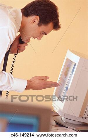 Businessman talking on phone View Large Photo Image Picture - Businessman talking on phone. Fotosearch