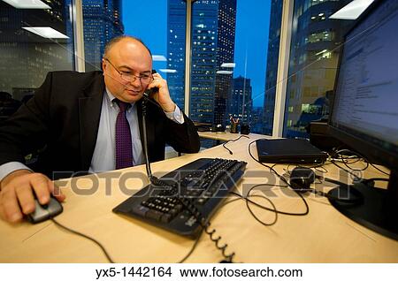 Businessman talking on the phone View Large Photo Image Picture - Businessman talking on the phone. Fotosearch