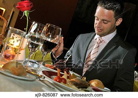 Businessman that meal in a restaurant View Large Photo Image Stock Photo - Businessman that meal in a restaurant. Fotosearch