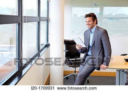 Businessman using tablet computer View Large Photo Image Stock Image - Businessman using tablet computer. Fotosearch
