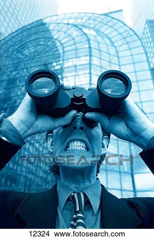 Businessman with binoculars View Large Photo Image Picture - Businessman with binoculars. Fotosearch