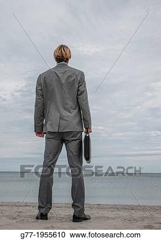 Businessman with briefcase on the beach. Miami, USA View Large Photo Image Stock Image - Businessman with briefcase on the beach. Miami, USA. Fotosearch