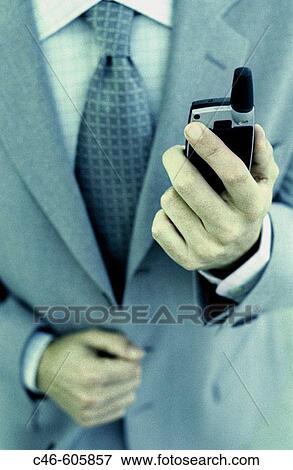 Stock Photo - Businessman with cell phone. Fotosearch