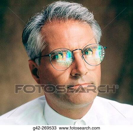Businessman with chart reflections View Large Photo Image Stock Image - Businessman with chart reflections. Fotosearch
