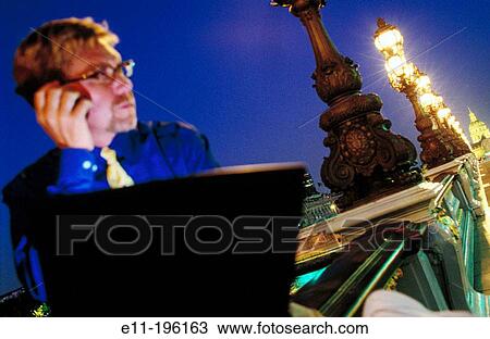 Stock Image - Businessman with laptop. Paris. France. Fotosearch