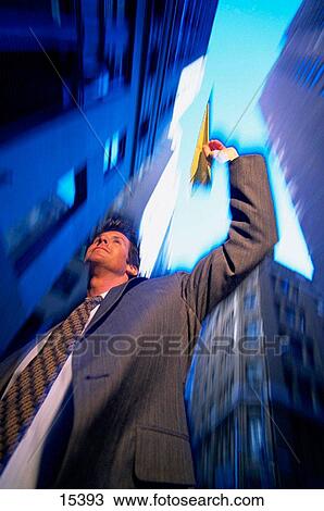 Businessman with paper plane View Large Photo Image Stock Image - Businessman with paper plane. Fotosearch