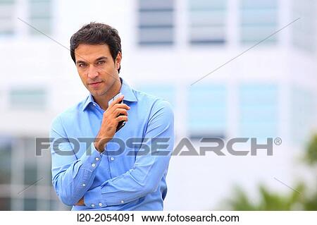Stock Image - Businessman with smartphone business center. San Sebastian Technology Park. Donostia. Gipuzkoa. Basque Country. Spain.. Fotosearch